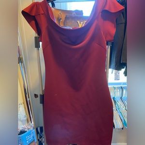 A wine body con dress with ruffle sleeves.